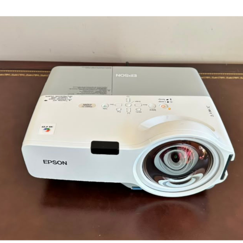 Buy the Epson PowerLite 410W 3LCD short throw projector with WXGA resolution, 2,000 ANSI lumens, built-in speaker, power cord, and VGA to HDMI adapter. EX-USA tested.
